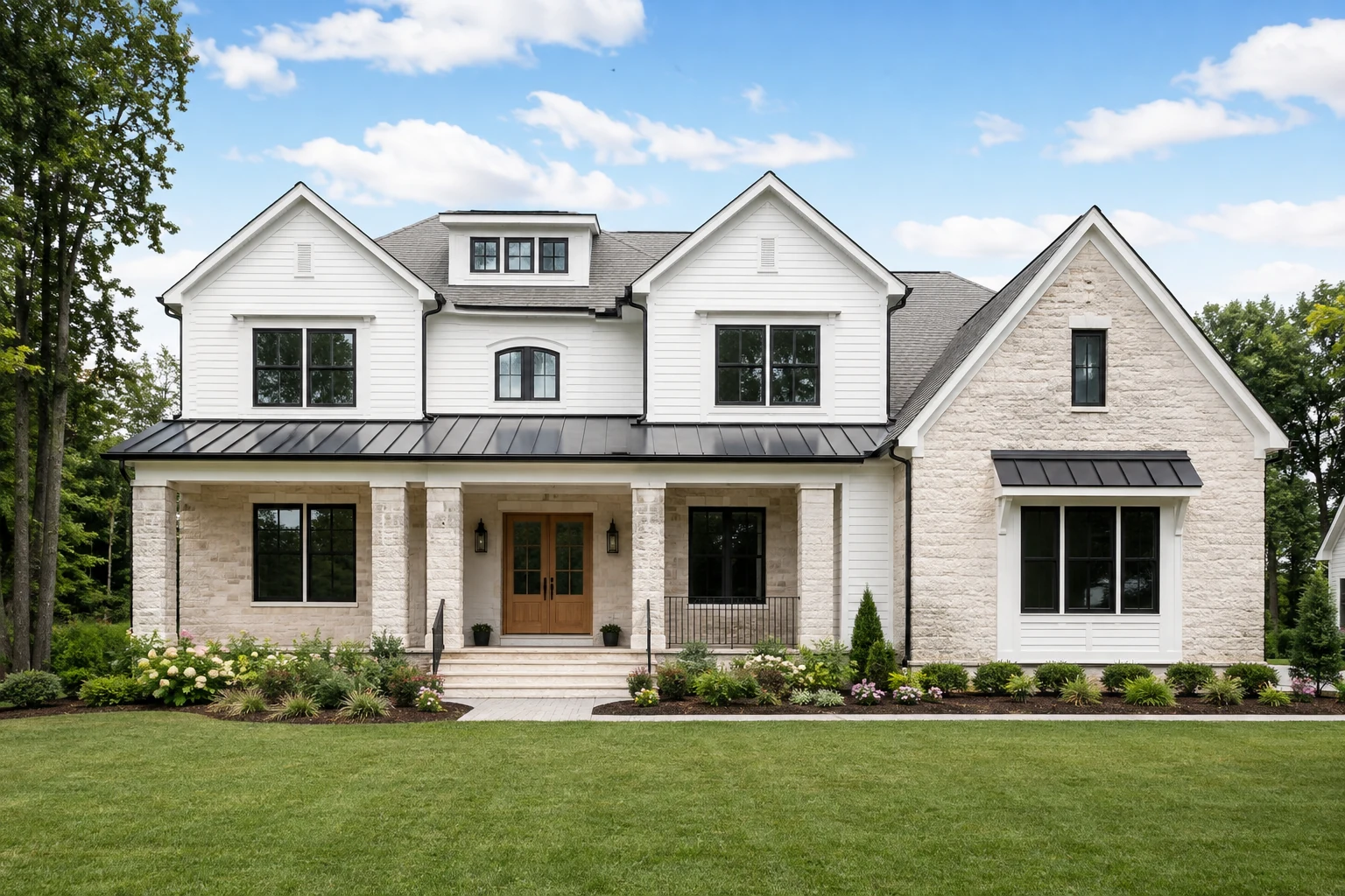 Custom home design inspiration with white siding, stone, and a covered front porch